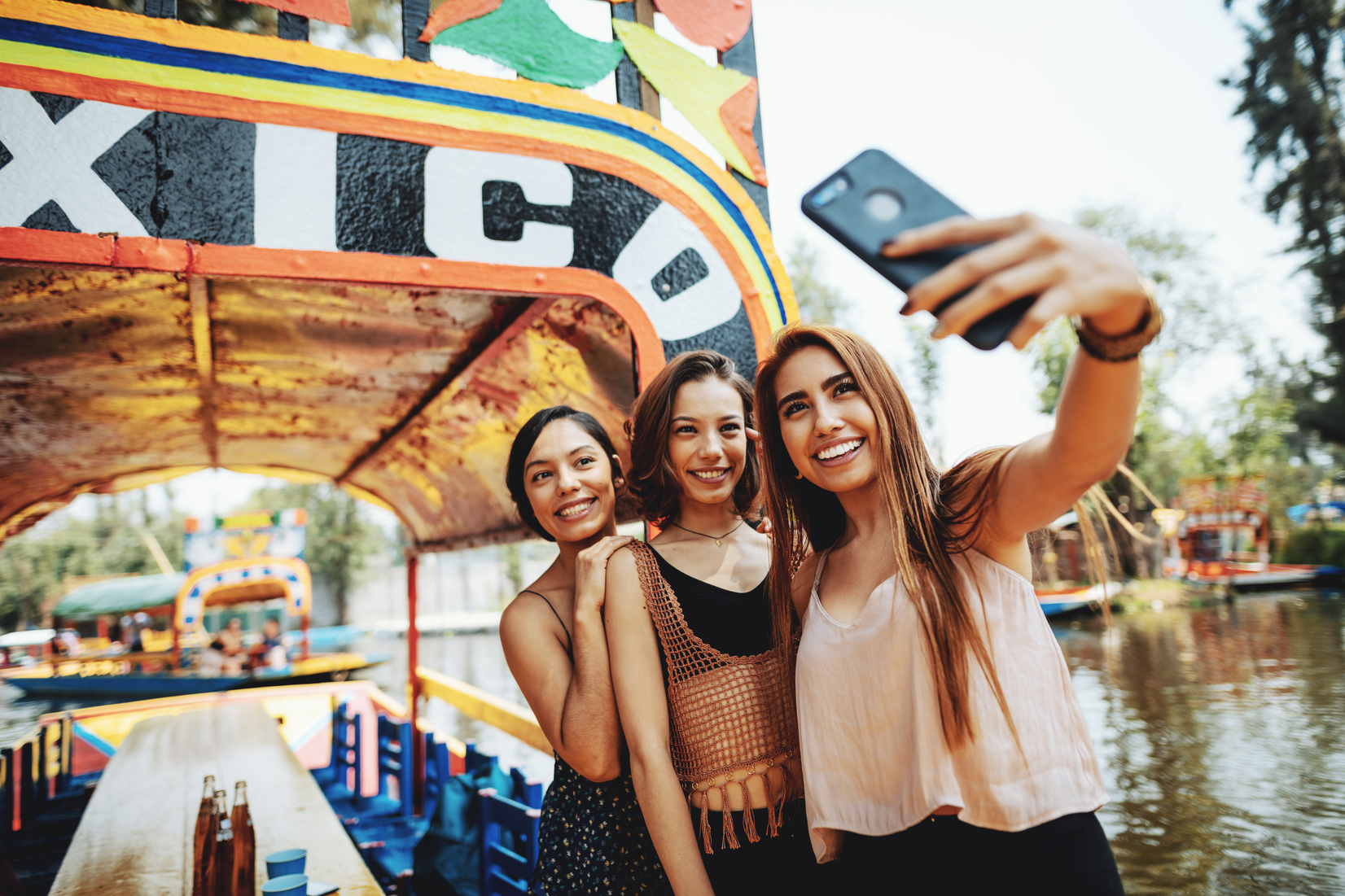 Millennial women in Mexico enjoying day in Xochimilco Gardens